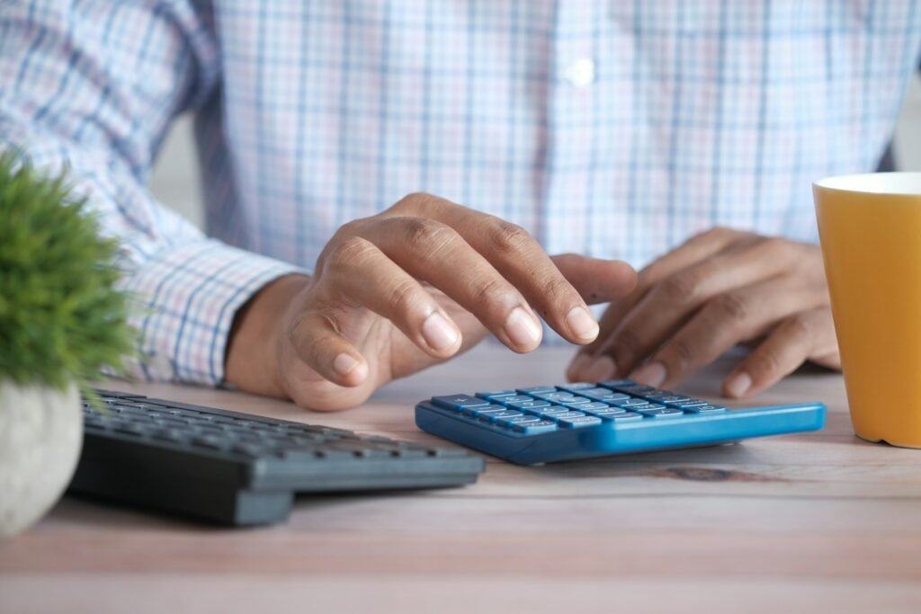 Accountant using a calculator at a desk