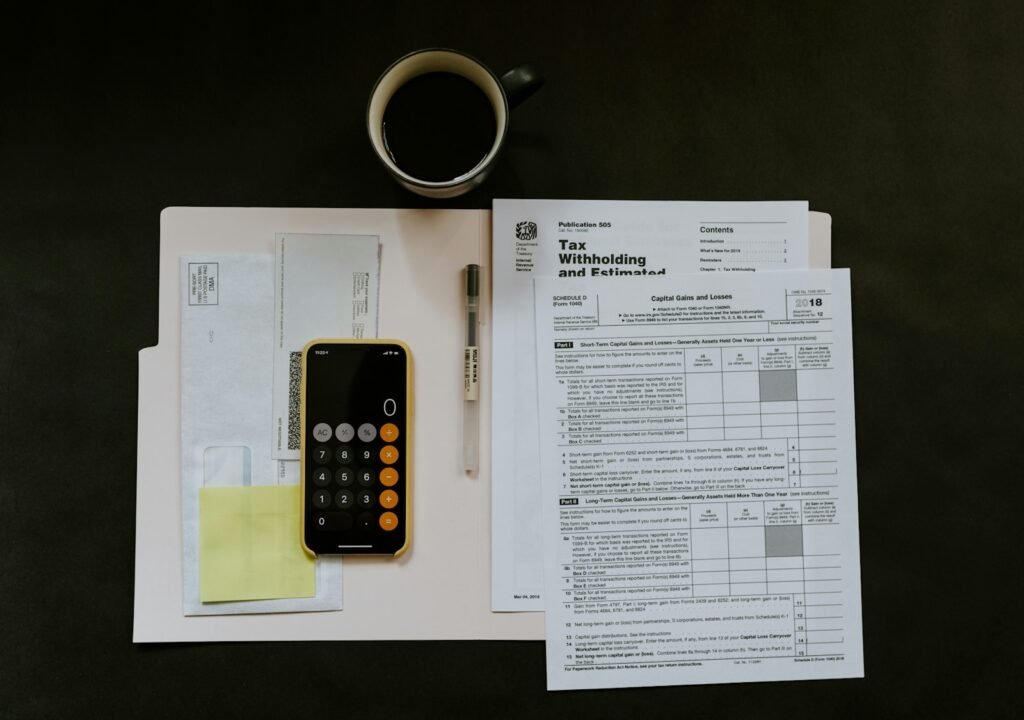 Tax forms and calculator on a desk